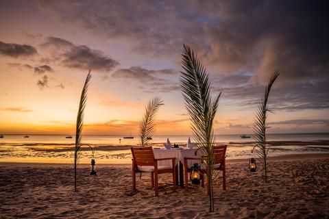 A romantic dinner set on the beach in Mozambique