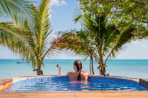 Woman at Azura Retreats luxury mozambique accommodation in pool